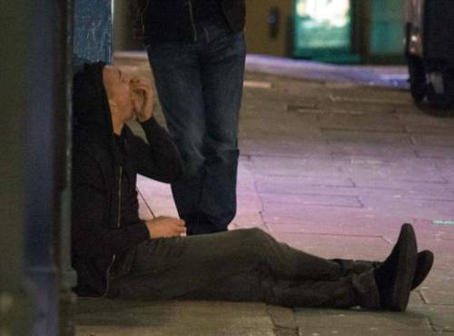 A Colombian police(R) escorts a member of the Bolivarian National Armed Forces of Venezuela who deserted to Colombia with his dog, in Cututa on February 25, 2019. - More than one hundred Venezuelan soldiers have deserted and crossed into Colombia, immigration authorities reported as tensions rise between the neighbors over humanitarian aid. Venezuelan President Nicolas Maduro claims the aid is a smokescreen for a US invasion, and has ordered several crossings on Venezuela's borders with Colombia and Brazil closed. (Photo by Luis ROBAYO / AFP)