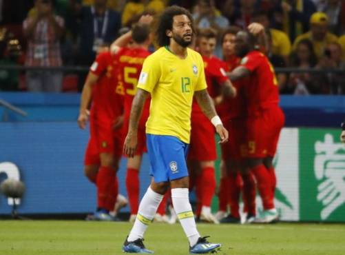 Kazan (Russian Federation), 06/07/2018.- Marcelo of Brazil reacts after Belgium scored the 0-2 goal during the FIFA World Cup 2018 quarter final soccer match between Brazil and Belgium in Kazan, Russia, 06 July 2018. (RESTRICTIONS APPLY: Editorial Use Only, not used in association with any commercial entity - Images must not be used in any form of alert service or push service of any kind including via mobile alert services, downloads to mobile devices or MMS messaging - Images must appear as still images and must not emulate match action video footage - No alteration is made to, and no text or image is superimposed over, any published image which: (a) intentionally obscures or removes a sponsor identification image; or (b) adds or overlays the commercial identification of any third party which is not officially associated with the FIFA World Cup) (Mundial de Fútbol, Bélgica, Brasil, Rusia) EFE/EPA/DIEGO AZUBEL EDITORIAL USE ONLY