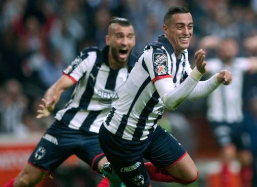 Monterrey' Rogelio Funes Mori (R) celebrates withe teammates after scoring against America during the Mexican Apertura 2019 tournament first leg final football, match at the BBVA Bancomer stadium in Monterrey, Mexico, on December 26, 2019. (Photo by Julio Cesar AGUILAR / AFP)