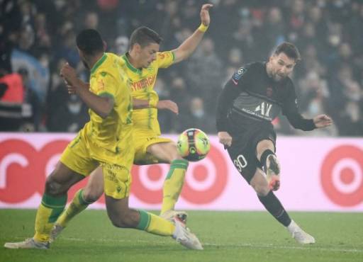 Paris Saint-Germain's Argentinian forward Lionel Messi shoots and scores a goal during the French L1 football match between Paris-Saint Germain (PSG) and FC Nantes at The Parc des Princes Stadium in Paris on November 20, 2021. (Photo by FRANCK FIFE / AFP)