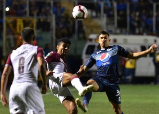 Motagua's Omar Elvir (R) vies for the ball with Saprissa's Ricardo Blanco (L) during their Concacaf League final at the National stadium, in Tegucigalpa, on November 26, 2019. (Photo by ORLANDO SIERRA / AFP)