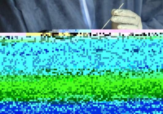 A health worker collects a swab sample for a COVID-19 coronavirus test from a woman in Bogota on December 21, 2020. - The main cities in Colombia announced Monday restrictions that affect some 15 million people due to an increase in the speed of contagion of the new coronavirus in the framework of the Christmas festivities (Photo by Juan BARRETO / AFP)