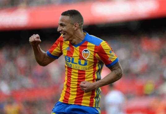 Valencia's Spanish forward Rodrigo Moreno celebrates after scoring a goal during the Spanish league football match between Sevilla and Valencia at the Ramon Sanchez Pizjuan stadium in Sevilla on March 10, 2018. / AFP PHOTO / Cristina Quicler