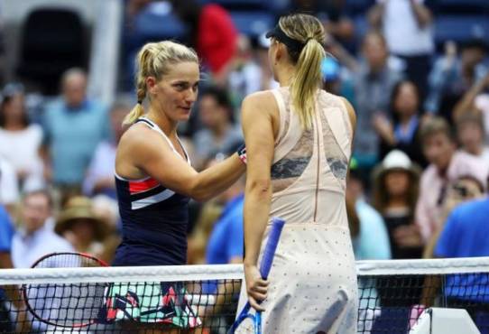NEW YORK, NY - AUGUST 30: Maria Sharapova of Russia shakes hands with Timea Babos of Hungary after their second round Women's Singles match on Day Three of the 2017 US Open at the USTA Billie Jean King National Tennis Center on August 30, 2017 in the Flushing neighborhood of the Queens borough of New York City. Al Bello/Getty Images/AFP