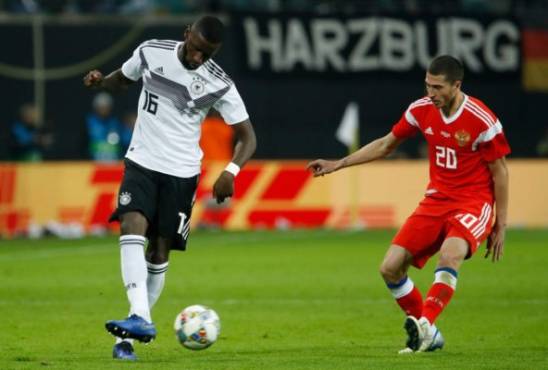 Germany's defender Antonio Ruediger (L) and Russia's midfielder Alexey Ionov vie for the ball during the international friendly football match Germany v Russia in Leipzig, eastern Germany on November 15, 2018. (Photo by Odd ANDERSEN / AFP)