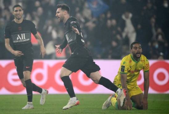 Paris Saint-Germain's Argentinian forward Lionel Messi celebrates after scoring a goal during the French L1 football match between Paris-Saint Germain (PSG) and FC Nantes at The Parc des Princes Stadium in Paris on November 20, 2021. (Photo by FRANCK FIFE / AFP)