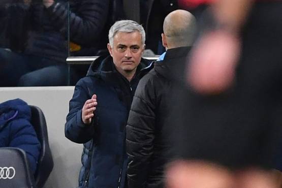 Tottenham Hotspur's Portuguese head coach Jose Mourinho (L) goes to shake hands with Manchester City's Spanish manager Pep Guardiola on the final whistle in the English Premier League football match between Tottenham Hotspur and Manchester City at Tottenham Hotspur Stadium in London, on February 2, 2020. - Tottenham won the game 2-0. (Photo by Ben STANSALL / AFP) / RESTRICTED TO EDITORIAL USE. No use with unauthorized audio, video, data, fixture lists, club/league logos or 'live' services. Online in-match use limited to 120 images. An additional 40 images may be used in extra time. No video emulation. Social media in-match use limited to 120 images. An additional 40 images may be used in extra time. No use in betting publications, games or single club/league/player publications. /