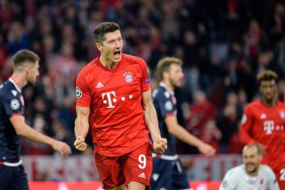 Bayern Munich's Polish forward Robert Lewandowski celebrate scoring the 2-0 goal during the UEFA Champions League Group B football match between FC Bayern Munich and Red Star Belgrade (Crvena Zvezda) in Munich, southern Germany, on September 18, 2019. (Photo by Matthias Balk / dpa / AFP) / Germany OUT
