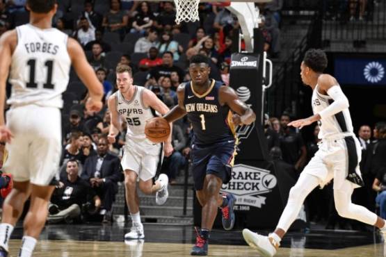 SAN ANTONIO, TX - OCTOBER 13: Zion Williamson #1 of the New Orleans Pelicans handles the ball against the San Antonio Spurs during a pre-season game on October 13, 2019 at the AT&T Center in San Antonio, Texas. NOTE TO USER: User expressly acknowledges and agrees that, by downloading and or using this photograph, user is consenting to the terms and conditions of the Getty Images License Agreement. Mandatory Copyright Notice: Copyright 2019 NBAE Logan Riely/NBAE via Getty Images/AFP