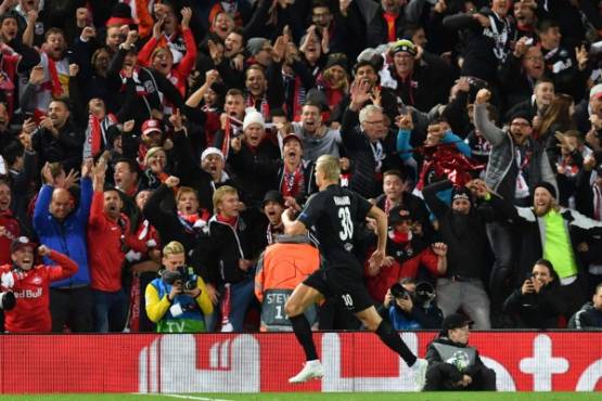 Salzburg's Norwegian forward Erling Braut Haland (C) celebrates after scoring their third goal during the UEFA Champions league Group E football match between Liverpool and Salzburg at Anfield in Liverpool, north west England on October 2, 2019. (Photo by Paul ELLIS / AFP)