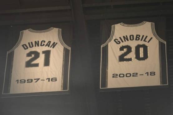 SAN ANTONIO, TX - MARCH 28: Jerseys of Retired NBA Legends Tim Duncan #21 and Manu Ginobili #20 of the San Antonio Spurs are seen in the rafters on March 28, 2018 at the AT&T Center in San Antonio, Texas. NOTE TO USER: User expressly acknowledges and agrees that, by downloading and or using this photograph, user is consenting to the terms and conditions of the Getty Images License Agreement. Mandatory Copyright Notice: Copyright 2018 NBAE Mark Sobhani/NBAE via Getty Images/AFP