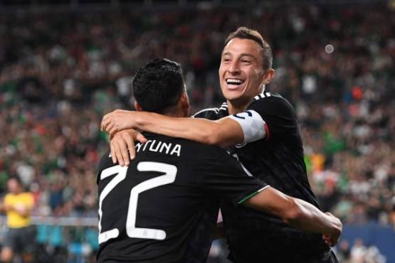 Mexico's midfielder Andres Guardado (R) celebrates with Mexico's forward Uriel Antuna after scoring a goal during the CONCACAF Gold Cup Group A match between Mexico and Canada on June 19, 2019 at Broncos Mile High stadium in Denver, Colorado. (Photo by Robyn Beck / AFP)