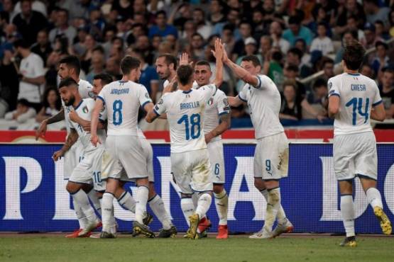 Italy's players celebrate after a goal scored by Italy's Nicolo Barella (C) during the Euro 2020 football qualification match between Greece and Italy at the Olympic Stadium in Athens on June 8, 2019. (Photo by LOUISA GOULIAMAKI / AFP)