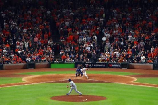 HOUSTON, TX - OCTOBER 30: Alex Bregman #2 of the Houston Astros hits a game-winning single during the tenth inning against Kenley Jansen #74 of the Los Angeles Dodgers in game five of the 2017 World Series at Minute Maid Park on October 30, 2017 in Houston, Texas. Ezra Shaw/Getty Images/AFP