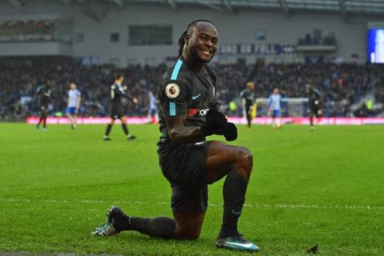 Chelsea's Nigerian midfielder Victor Moses celebrates after scoring their fourth goal during the English Premier League football match between Brighton and Hove Albion and Chelsea at the American Express Community Stadium in Brighton, southern England on January 20, 2018. / AFP PHOTO / Glyn KIRK / RESTRICTED TO EDITORIAL USE. No use with unauthorized audio, video, data, fixture lists, club/league logos or 'live' services. Online in-match use limited to 75 images, no video emulation. No use in betting, games or single club/league/player publications. /