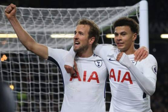 Tottenham Hotspur's English striker Harry Kane celebrates with Tottenham Hotspur's English midfielder Dele Alli (R) after scoring their second goal during the English Premier League football match between Burnley and Tottenham Hotspur at Turf Moor in Burnley, north west England on December 23, 2017. / AFP PHOTO / Lindsey PARNABY / RESTRICTED TO EDITORIAL USE. No use with unauthorized audio, video, data, fixture lists, club/league logos or 'live' services. Online in-match use limited to 75 images, no video emulation. No use in betting, games or single club/league/player publications. /