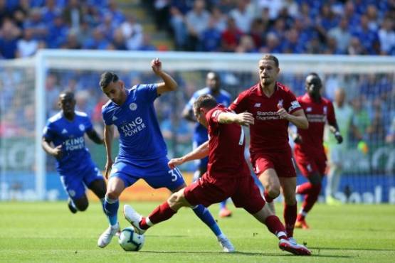 TK004. Leicester (United Kingdom), 01/09/2018.- Leicester City's Rachid Ghezzal (L) vies for the ball Liverpool's James Milner (C) during the English Premier League soccer match between Leicester City and Liverpool FC at the King Power Stadium in Leicester, Britain, 01 September 2018. EFE/EPA/TIM KEETON EDITORIAL USE ONLY. No use with unauthorized audio, video, data, fixture lists, club/league logos or 'live' services. Online in-match use limited to 120 images, no video emulation. No use in betting, games or single club/league/player publications.