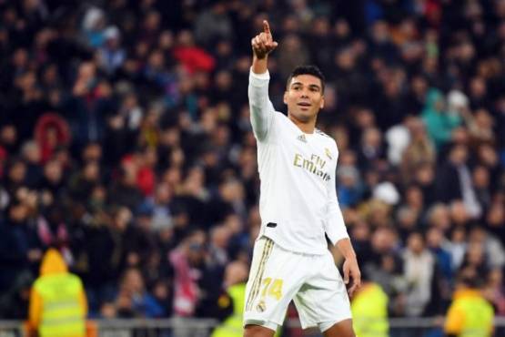Real Madrid's Brazilian midfielder Casemiro celebrates his second goal during the Spanish league football match between Real Madrid CF and Sevilla FC at the Santiago Bernabeu stadium in Madrid on January 18, 2020. (Photo by GABRIEL BOUYS / AFP)
