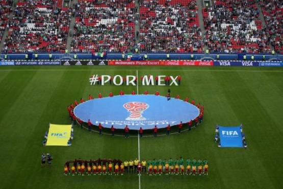 Portugal and Mexico's team line up before the 2017 Confederations Cup group A football match between Portugal and Mexico at the Kazan Arena in Kazan on June 18, 2017. / AFP PHOTO / Roman Kruchinin