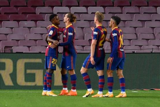 Barcelona's Spanish forward Ansu Fati (L) celebrates with teammates after scoring a second goal during the Spanish league football match FC Barcelona against Villarreal CF at the Camp Nou stadium in Barcelona on September 27, 2020. (Photo by Josep LAGO / AFP)
