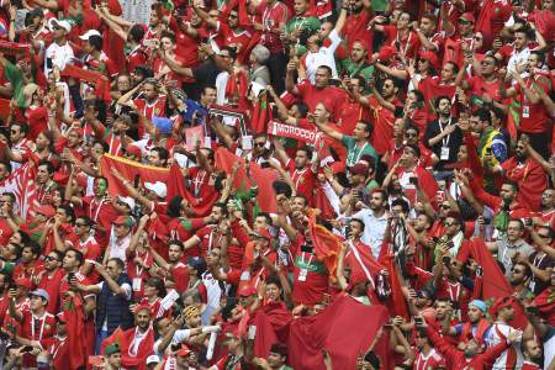 Morocco supporters cheer ahead of the Russia 2018 World Cup Group B football match between Portugal and Morocco at the Luzhniki Stadium in Moscow on June 20, 2018. / AFP PHOTO / Patrik STOLLARZ / RESTRICTED TO EDITORIAL USE - NO MOBILE PUSH ALERTS/DOWNLOADS