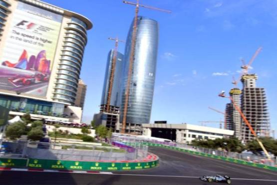 Local residents have a look at boulders which were carried down nearby hillsides from the overnight rain in Carpinteria, California on January 9, 2018. Mudslides unleashed by a ferocious storm demolished homes in southern California and killed at least 13 people, police said Tuesday. / AFP PHOTO / FREDERIC J. BROWN