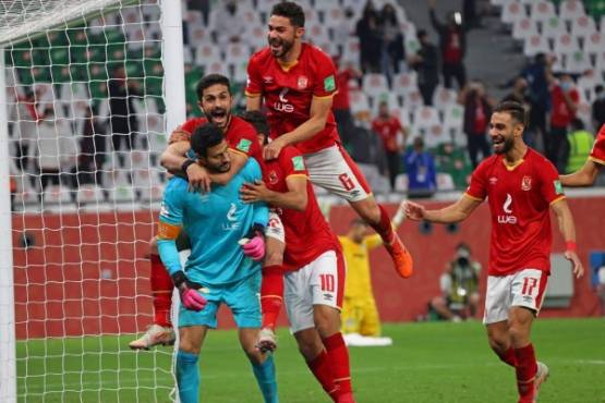 Ahly's players celebrate their win in the FIFA Club World Cup 3rd place football match between Egypt's Al-Ahly vs Brazil's Palmeiras at the Education City Stadium in the Qatari city of Ar-Rayyan on February 11, 2021. (Photo by Karim JAAFAR / AFP)