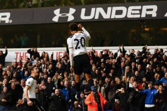Tottenham Hotspur's English midfielder Dele Alli celebrates after scoring their third goal during the English Premier League football match between Tottenham Hotspur and Everton at White Hart Lane in London, on March 5, 2017.Tottenham won the game 3-2. / AFP PHOTO / Adrian DENNIS / RESTRICTED TO EDITORIAL USE. No use with unauthorized audio, video, data, fixture lists, club/league logos or 'live' services. Online in-match use limited to 75 images, no video emulation. No use in betting, games or single club/league/player publications. /