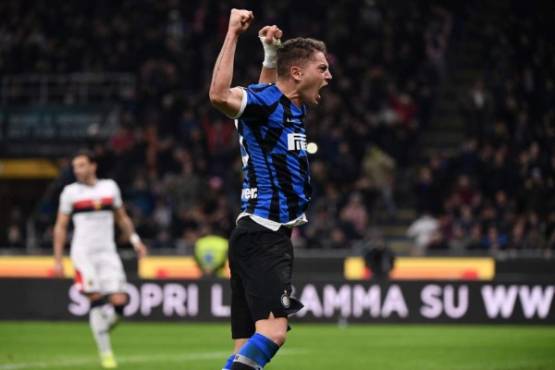 Inter Milan's Italian forward Sebastiano Esposito celebrates after scoring a penalty during the Italian Serie A football match Inter Milan vs Genoa on December 21, 2019 at the San Siro stadium in Milan. (Photo by Marco Bertorello / AFP)