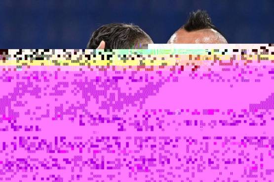 Inter Milan's Italian defender Danilo D'Ambrosio (L) embraces Inter Milan's Chilean midfielder Arturo Vidal after scoring during the Italian Serie A football match Inter vs Fiorentina on September 26, 2020 at the Giuseppe-Meazza (San Siro) stadium in Milan. (Photo by MIGUEL MEDINA / AFP)