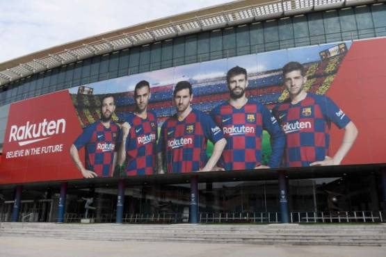 A picture shows the empty entrance to the Camp Nou stadium in Barcelona on March 13, 2020 after La Liga said Spain's top two divisions would be suspended for at least two weeks over the coronavirus outbreak. (Photo by Josep LAGO / AFP)