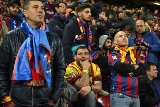 Barcelona fans react after losing 4-0 after the UEFA Champions league semi-final second leg football match between Liverpool and Barcelona at Anfield in Liverpool, north west England on May 7, 2019. (Photo by Oli SCARFF / AFP)