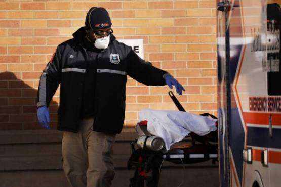 NEW YORK, NY - APRIL 10: Medical workers take in patients at a special coronavirus intake area at Maimonides Medical Center on April 10, 2020 in the Borough Park neighborhood of the Brooklyn borough of New York City. Hospitals in New York City, which has been especially hard hit by the coronavirus, are facing shortages of beds, ventilators and protective equipment for medical staff. Spencer Platt/Getty Images/AFP