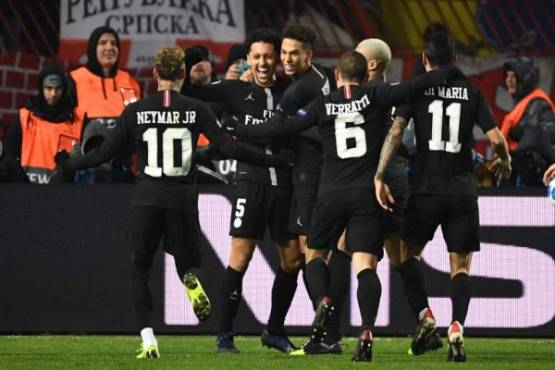 Paris Saint-Germain's Brazilian defender Marquinhos (C) celebrates with teammates after scoring a goal during the European Champions League football match Crvena Zvezda Belgrade vs Paris Saint-Germain (PSG) on December 11, 2018 at Rajko-Mitic stadium in Belgarde. (Photo by FRANCK FIFE / AFP)