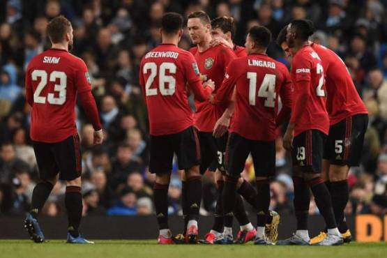 Manchester United's Serbian midfielder Nemanja Matic (C) celebrates scoring the opening goal during the English League Cup semi-final second leg football match between Manchester City and Manchester United at the Etihad Stadium in Manchester, north west England, on January 29, 2020. (Photo by Oli SCARFF / AFP) / RESTRICTED TO EDITORIAL USE. No use with unauthorized audio, video, data, fixture lists, club/league logos or 'live' services. Online in-match use limited to 120 images. An additional 40 images may be used in extra time. No video emulation. Social media in-match use limited to 120 images. An additional 40 images may be used in extra time. No use in betting publications, games or single club/league/player publications. /