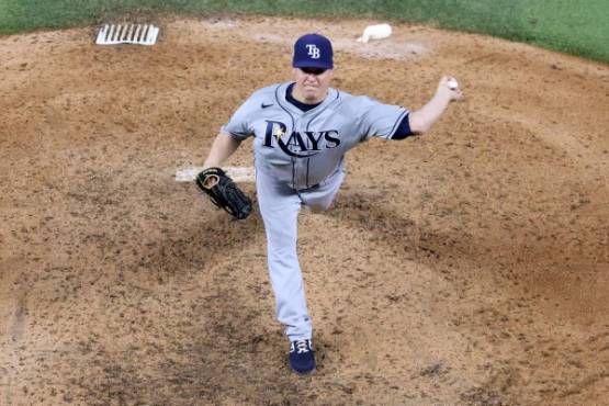 ARLINGTON, TEXAS - OCTOBER 21: Aaron Loup #15 of the Tampa Bay Rays delivers the pitch against the Los Angeles Dodgers during the ninth inning in Game Two of the 2020 MLB World Series at Globe Life Field on October 21, 2020 in Arlington, Texas. Maxx Wolfson/Getty Images/AFP