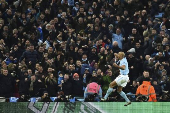 Manchester City's Belgian defender Vincent Kompany celebrates after scoring their second goal during the English League Cup final football match between Manchester City and Arsenal at Wembley stadium in north London on February 25, 2018. / AFP PHOTO / Glyn KIRK / RESTRICTED TO EDITORIAL USE. No use with unauthorized audio, video, data, fixture lists, club/league logos or 'live' services. Online in-match use limited to 75 images, no video emulation. No use in betting, games or single club/league/player publications. /