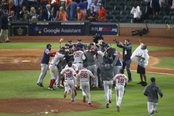 HOUSTON, TX - OCTOBER 18: The Boston Red Sox celebrate after defeating the Houston Astros in Game Five of the American League Championship Series at Minute Maid Park on October 18, 2018 in Houston, Texas. Tim Warner/Getty Images/AFP