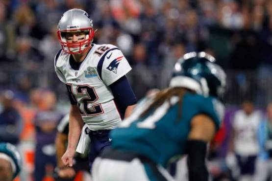 MINNEAPOLIS, MN - FEBRUARY 04: Tom Brady #12 of the New England Patriots prepares to snap the ball during the first quarter against the Philadelphia Eagles in Super Bowl LII at U.S. Bank Stadium on February 4, 2018 in Minneapolis, Minnesota. Kevin C. Cox/Getty Images/AFP