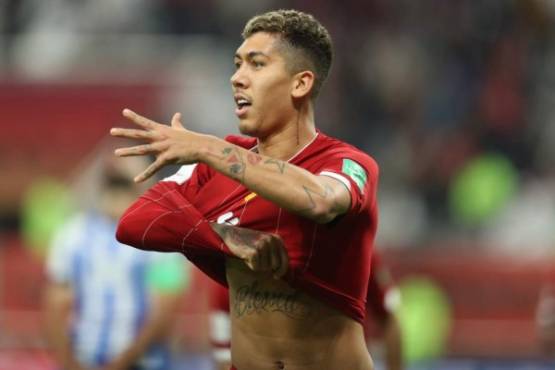 Liverpool's Brazilian midfielder Roberto Firmino celebrates his goal during the 2019 FIFA Club World Cup semi-final football match between Mexico's Monterrey and England's Liverpool at the Khalifa International Stadium in the Qatari capital Doha on December 18, 2019. (Photo by KARIM JAAFAR / AFP)
