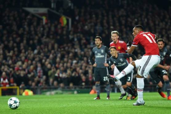 Manchester United's French striker Anthony Martial has this penalty kick saved during the UEFA Champions League Group A football match between Manchester United and Benfica at Old Trafford in Manchester, north west England on October 31, 2017. / AFP PHOTO / Oli SCARFF