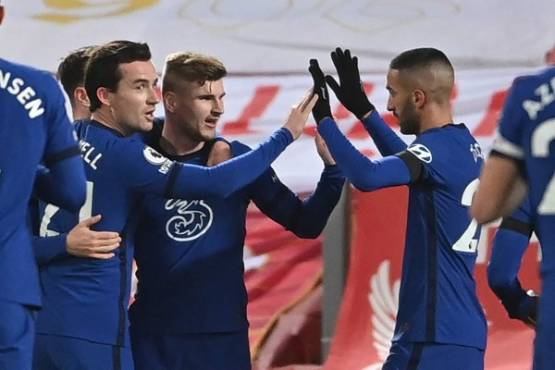 Chelsea's German striker Timo Werner (C) celebrates with teammates but goal disallowed by VAR during the English Premier League football match between Liverpool and Chelsea at Anfield in Liverpool, north west England on March 4, 2021. (Photo by Laurence Griffiths / POOL / AFP) / RESTRICTED TO EDITORIAL USE. No use with unauthorized audio, video, data, fixture lists, club/league logos or 'live' services. Online in-match use limited to 120 images. An additional 40 images may be used in extra time. No video emulation. Social media in-match use limited to 120 images. An additional 40 images may be used in extra time. No use in betting publications, games or single club/league/player publications. /