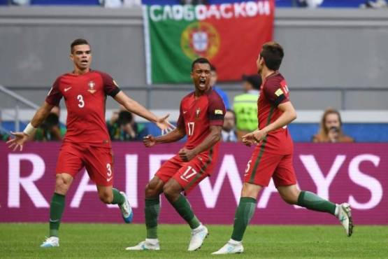 (From L) Portugal's defender Pepe, Portugal's forward Nani and Portugal's defender Raphael Guerreiro celebrate for a goal which was ruled off side after video assistance during the 2017 Confederations Cup group A football match between Portugal and Mexico at the Kazan Arena in Kazan on June 18, 2017. / AFP PHOTO / FRANCK FIFE