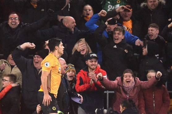 Wolverhampton Wanderers' Mexican striker Raul Jimenez celebrates after he scores his team's first goal during the English Premier League football match between Wolverhampton Wanderers and Liverpool at the Molineux stadium in Wolverhampton, central England on January 23, 2020. (Photo by Oli SCARFF / AFP) / RESTRICTED TO EDITORIAL USE. No use with unauthorized audio, video, data, fixture lists, club/league logos or 'live' services. Online in-match use limited to 120 images. An additional 40 images may be used in extra time. No video emulation. Social media in-match use limited to 120 images. An additional 40 images may be used in extra time. No use in betting publications, games or single club/league/player publications. /