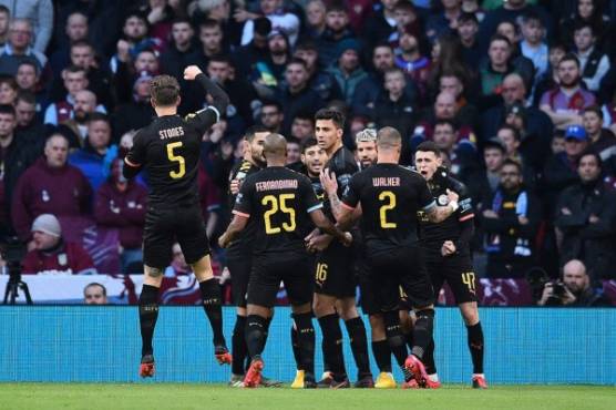 Manchester City's Argentinian striker Sergio Aguero (3R) celebrates scoring the opening goal with teammates during the English League Cup final football match between Aston Villa and Manchester City at Wembley stadium in London on March 1, 2020. (Photo by Glyn KIRK / AFP) / RESTRICTED TO EDITORIAL USE. No use with unauthorized audio, video, data, fixture lists, club/league logos or 'live' services. Online in-match use limited to 120 images. An additional 40 images may be used in extra time. No video emulation. Social media in-match use limited to 120 images. An additional 40 images may be used in extra time. No use in betting publications, games or single club/league/player publications. /