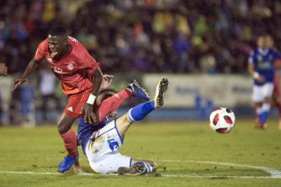Real Madrid's Brazilian forward Vinicius Junior (L) vies with UD Melilla's Spanish defender Ricardo Segura Richi during the Spanish King's Cup (Copa del Rey) football match between UD Melilla and Real Madrid CF at the Alvarez Claro municipal stadium in the autonomous city of Melilla on October 31, 2018. (Photo by JORGE GUERRERO / AFP)