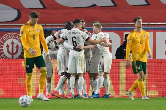 Belgium's players celebrate their goal by midfielder Thorgan Hazard (unseen) during the FIFA World Cup Qatar 2022 qualification football match between Belgium and Wales at the Den Dreef Stadium in Leuven on March 24, 2021. (Photo by JOHN THYS / AFP)