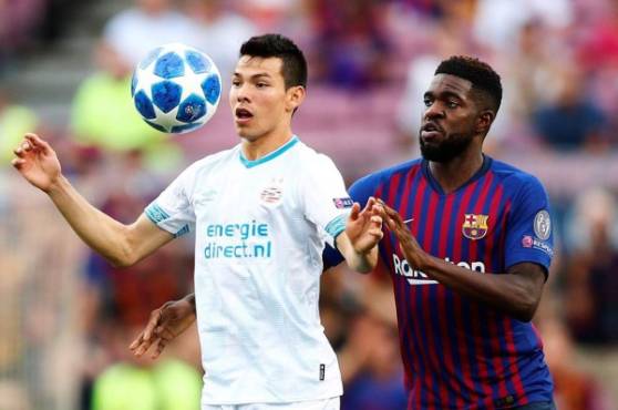Chucky Lozano es marcado por el francés Samuel Umtiti. FOTOS AFP