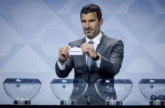 Portuguese former football player Luis Figo holds up the ticket of England during the draw for the League A of the second edition of the UEFA Nations League football tournament on March 3, 2020, in Amsterdam. (Photo by Robin VAN LONKHUIJSEN / ANP / AFP) / Netherlands OUT