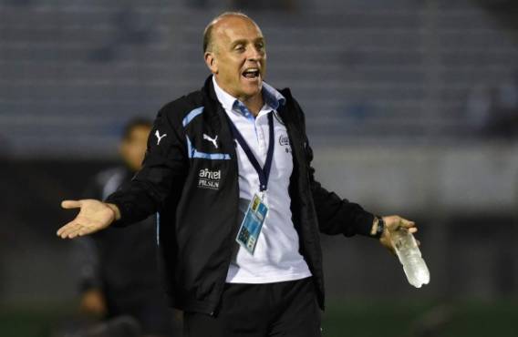 Uruguay coach Fabian Coito reacts on the pitch sidelines while watching his players in their South America Under-20 soccer match against Colombia in Montevideo, Uruguay, Wednesday, Feb. 4, 2015. (AP Photo/Matilde Campodonico)